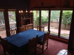 The dining table seats 6 guests and overlooks the patio